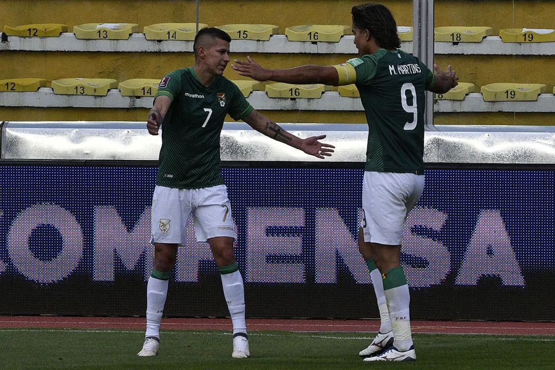 Juan Carlos Arce e Marcelo Moreno (à dir.) marcaram os gols da seleção boliviana | Foto: AFP