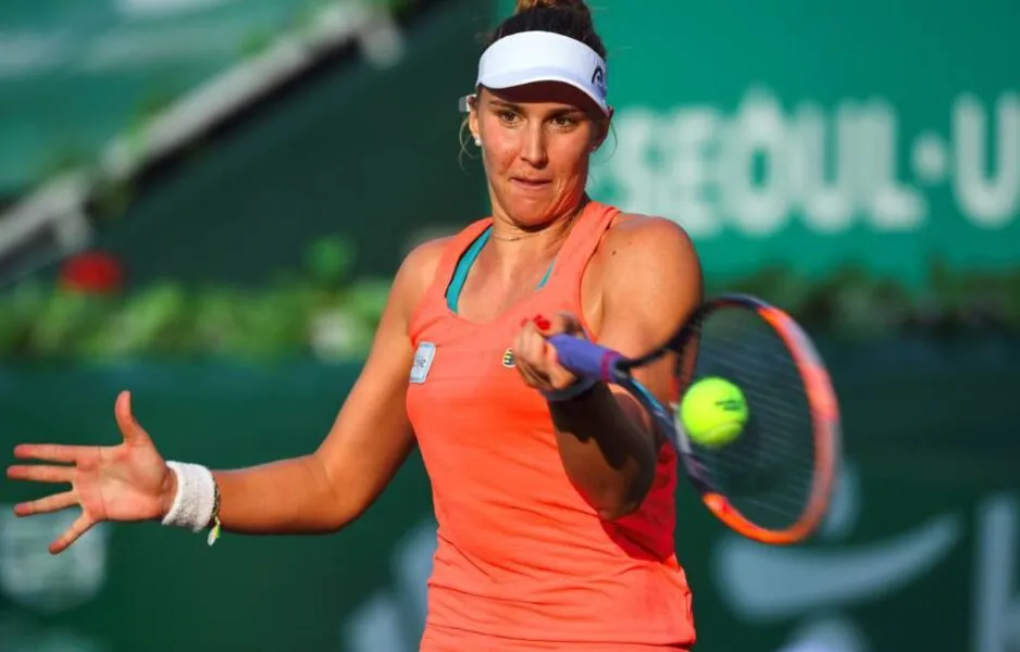 Beatriz Haddad Maia of Brazil hits a return against Richel Hogenkamp of the Netherlands during their women's singles semi-final match at the WTA Korea Open tennis championships in Seoul on September 23, 2017.  / AFP PHOTO / JUNG Yeon-Je