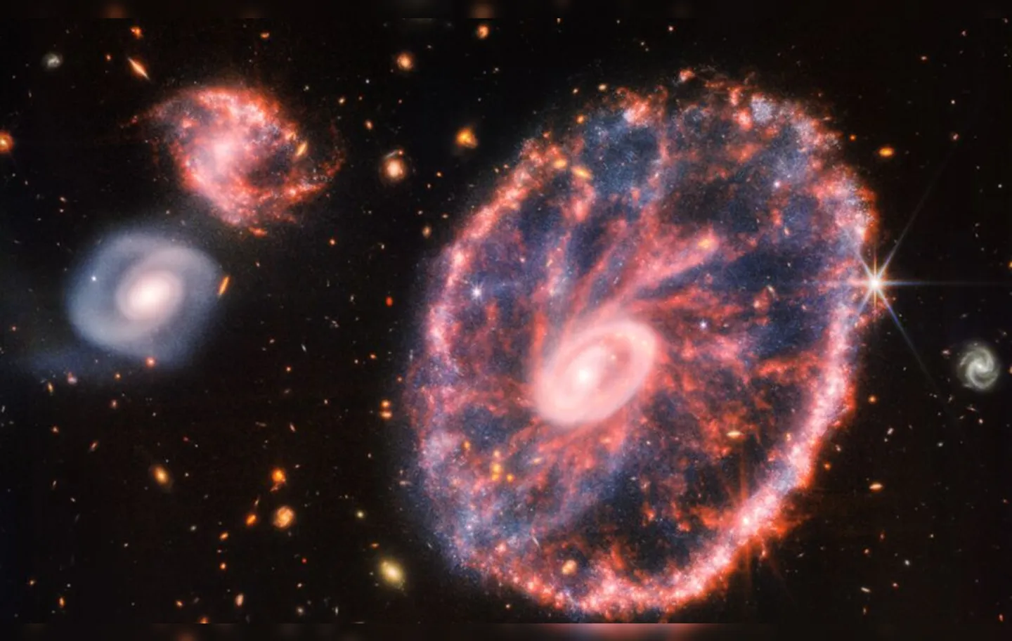 Antes de se colidir com outra galáxia, Carthwheel tinha provavelmente formato espiral similar ao da Via Láctea
