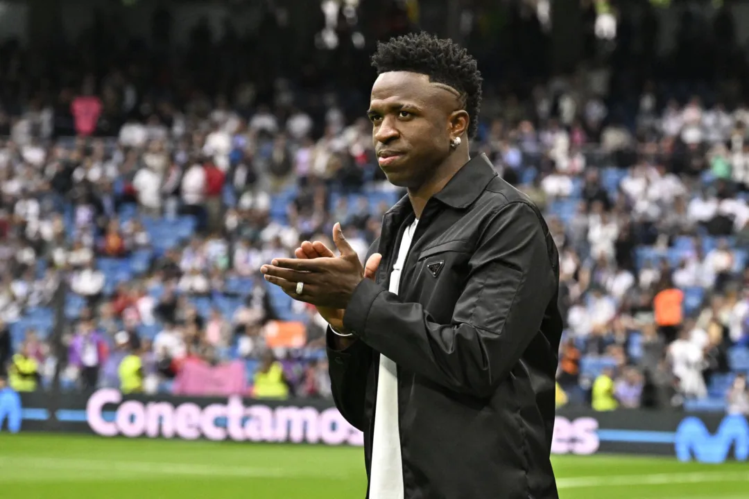 Real Madrid's Brazilian forward Vinicius Junior greets the audience prior the Spanish league football match between Real Madrid CF and Rayo Vallecano de Madrid at the Santiago Bernabeu stadium in Madrid on May 24, 2023. Vinicius drew global support after making a stand against racist abuse he received on May 21 from Valencia supporters at their Mestalla stadium. (Photo by JAVIER SORIANO / AFP)