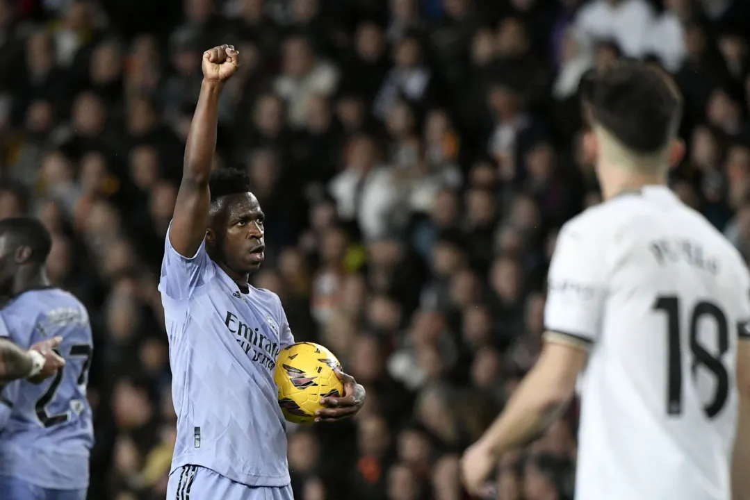 Real Madrid's Brazilian forward #07 Vinicius Junior celebrates scoring his team's first goal during the Spanish league football match between Valencia CF and Real Madrid at the Mestalla stadium in Valencia on March 2, 2024 (Photo by Jose Jordan / AFP)