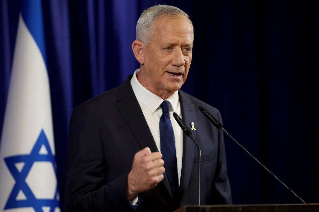 Israeli war cabinet minister Benny Gantz announces his resignation during a televised address in the Israeli city of Ramat Gan, near Tel Aviv on June 9, 2024. Israeli war cabinet minister Benny Gantz said on June 9, he was quitting the government after threatening last month to leave over the lack of post-war strategy for the Gaza Strip. "We are leaving the unity government with a heavy heart," Gantz said in a televised address. (Photo by JACK GUEZ / AFP)