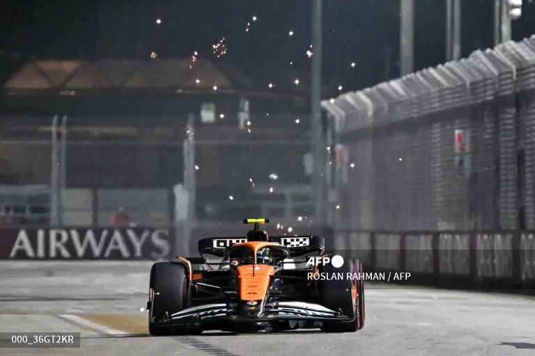 McLaren's British driver Lando Norris drives during the second practice session ahead of the Formula One Singapore Grand Prix night race at the Marina Bay Street Circuit in Singapore on September 20, 2024. (Photo by ROSLAN RAHMAN / AFP)