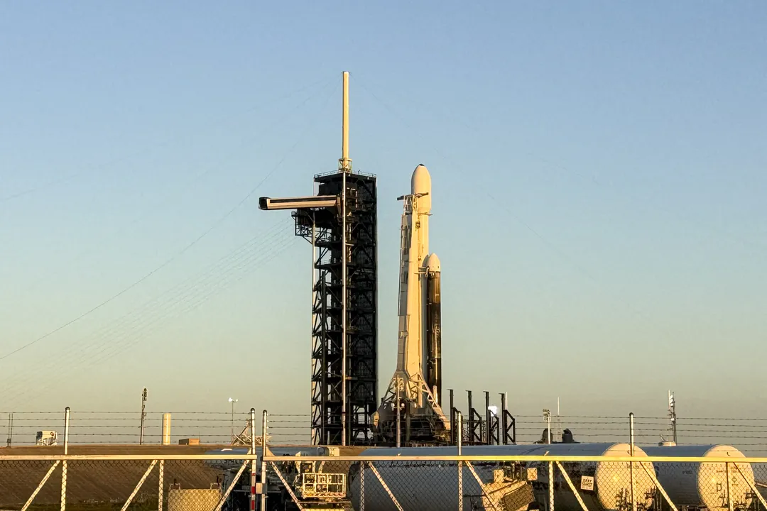 SpaceX Falcon Heavy rocket with the Clipper spacecraft sits on launch pad 39A before the launch at the Kennedy Space Center in Florida on October 14, 2024. The spacecraft Clipper will soon launch for Jupiter's moon Europa, one of dozens of moons orbiting the Solar System?s biggest planet and the nearest spot in our celestial neighborhood that could offer a perch for life. It should reach orbit around Jupiter and Europa in 2031, where it will begin a detailed study of the moon scientists believe is covered in frozen water, which could provide a similar habitat to Earth. (Photo by CHANDAN KHANNA / AFP)