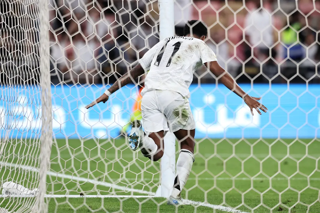 Real Madrid's Brazilian forward #11 Rodrygo celebrates scoring his team's third goal during the Spanish Super Cup semi-final football match between Real Madrid and Mallorca at the King Abdullah Sport City in Jeddah on January 9, 2025. (Photo by FADEL SENNA / AFP)