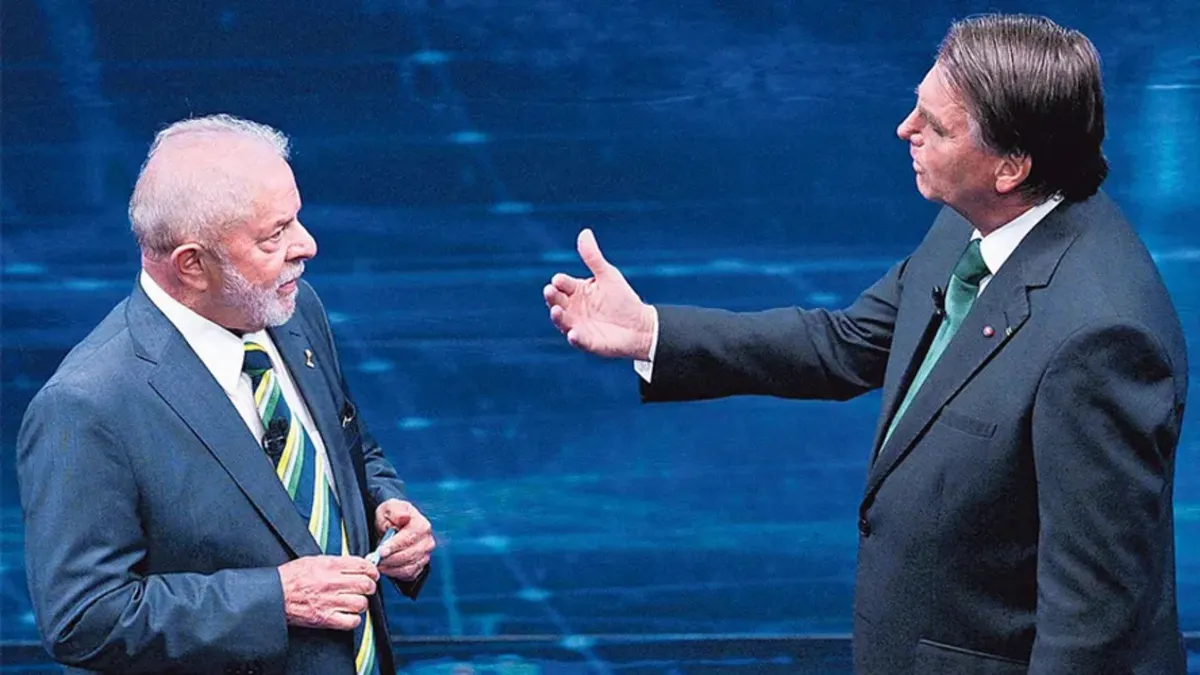 Lula e o ex-presidente Bolsonaro durante debate