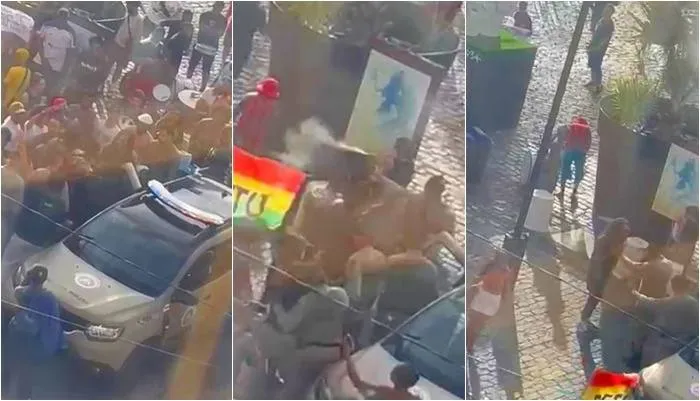 Imagens que circulam nas redes sociais, mostram manifestantes com bandeiras coloridas