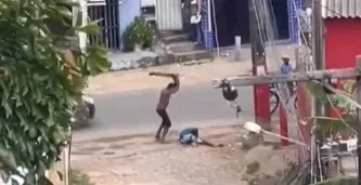 Mesmo caído  no chão, homem continua sendo agredido