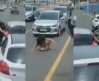 Mulher seminua é expulsa de carro e briga para trânsito em Salvador