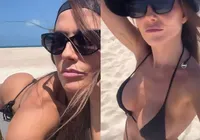 Deborah Secco ostenta biquíni fio-dental em praia do Ceará