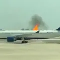 Cerca 300 passageiros são evacuados após incêndio em avião imagem