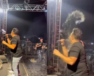 Cantor sai sangrando ao ser atingido por lata em show
