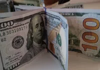 Economista-chefe do Bradesco faz previsão: dólar pode ficar abaixo de R$ 5