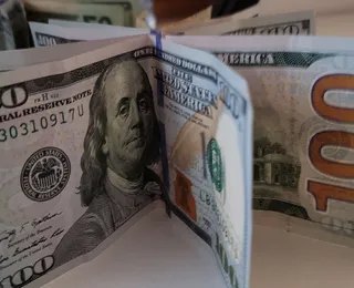 Economista-chefe do Bradesco faz previsão: dólar pode ficar abaixo de R$ 5