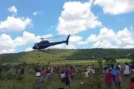 Empresário usa helicóptero para jogar carnes sobre cidade brasileira - Imagem