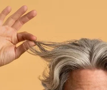 Estudo revela ligação inesperada entre cabelos brancos e câncer - Imagem