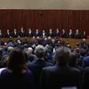Lula e Alcolumbre ficam lado a lado em posse de ministros no TSE - Imagem