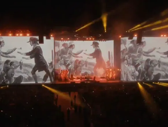 Banda faz protesto durante show contra guerra de Irã e Estados Unidos - Imagem