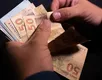 Caixa libera saque extra de quase R$ 1 mil para famílias; veja regras - Imagem