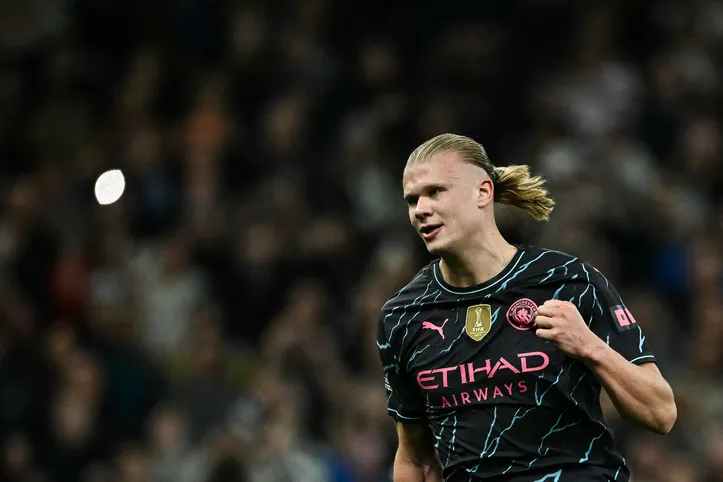 Manchester City's Norwegian striker #09 Erling Haaland celebrates after scoring his team second goal during the English Premier League football match between Tottenham Hotspur and Manchester City at the Tottenham Hotspur Stadium in London, on May 14, 2024. (Photo by Ben Stansall / AFP) / RESTRICTED TO EDITORIAL USE. No use with unauthorized audio, video, data, fixture lists, club/league logos or 'live' services. Online in-match use limited to 120 images. An additional 40 images may be used in extra time. No video emulation. Social media in-match use limited to 120 images. An additional 40 images may be used in extra time. No use in betting publications, games or single club/league/player publications. /