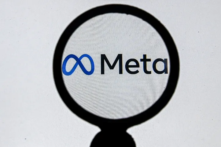 This photograph taken on October 28, 2021 shows the META logo on a laptop screen in Moscow as Facebook chief Mark Zuckerberg announced the parent company's name is being changed to 