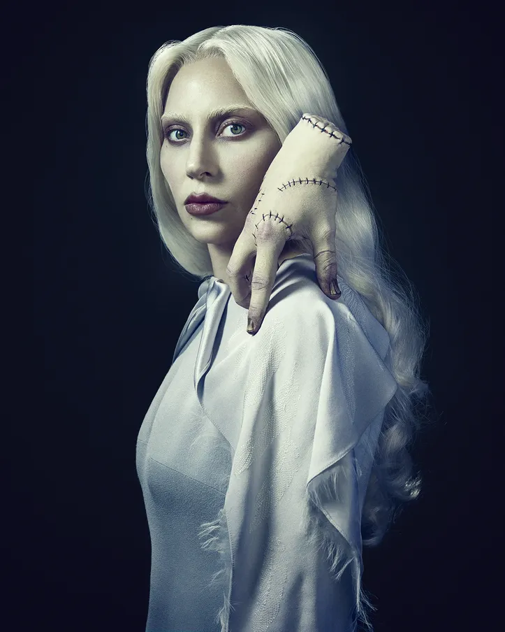 Wednesday. (L to R) Lady Gaga as Rosaline Rotwood, Thing on the set of Wednesday.  Cr. Sophy Holland/Netflix © 2025